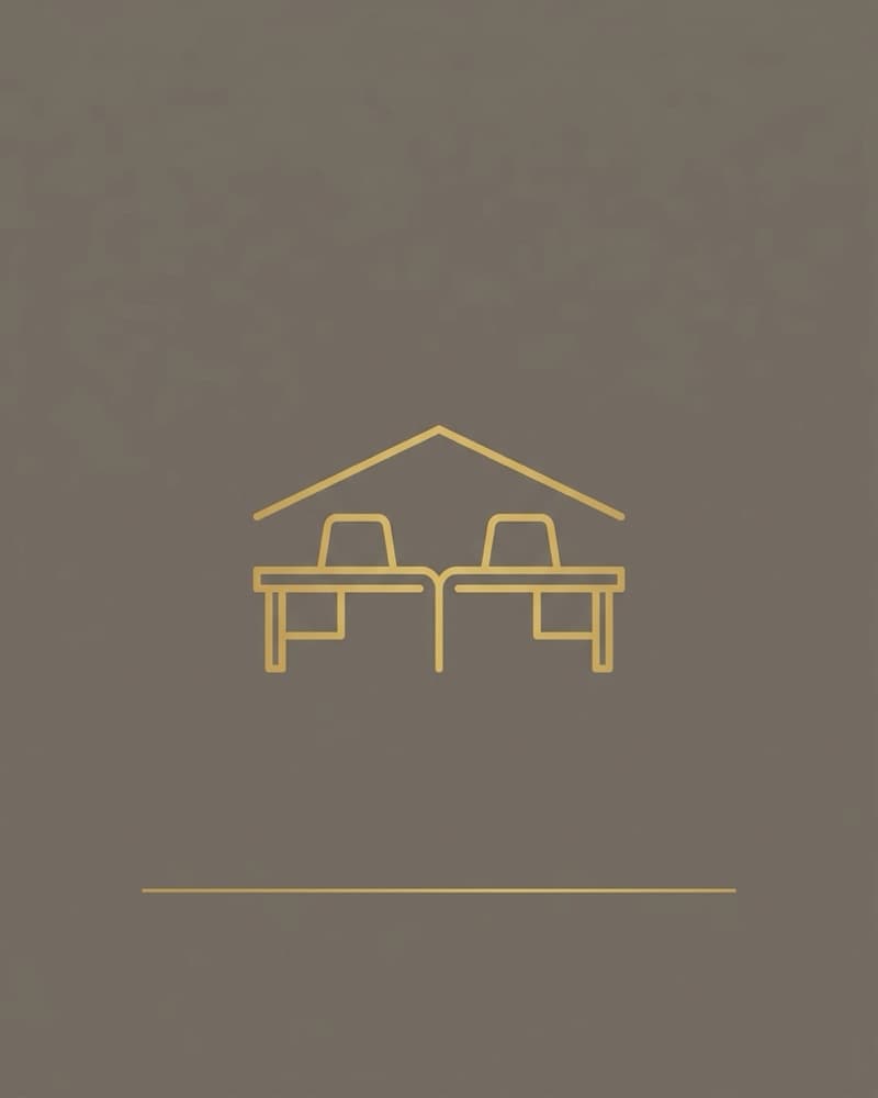 Line-icon cover art in gold on a brown background: two desks joined beneath one shared roofline